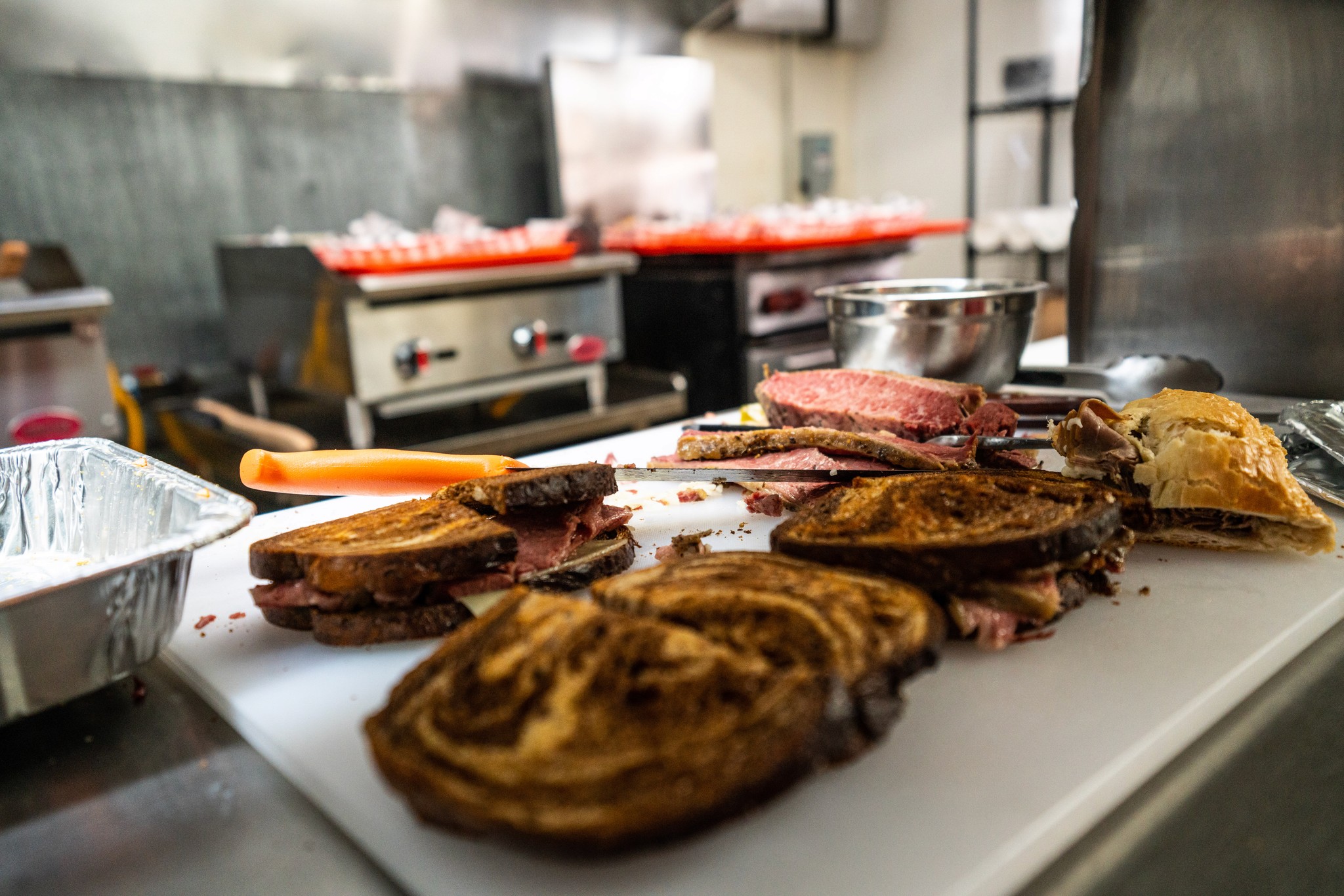 Corned beef briskets resting in the Redstone Kitchen prep line